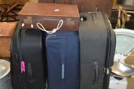 Three various fabric suitcases and a small leather suitcase (4)