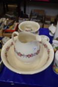 Cauldon wash bowl, jug, chamber pot and vase decorated with pink roses