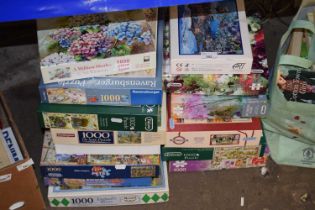Large quantity of assorted jigsaw puzzles