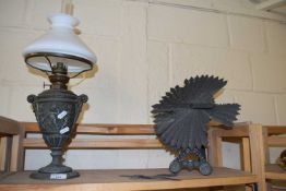 Oil lamp and a slate garden ornament