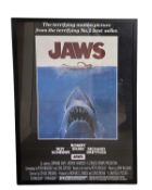 A framed and glazed poster for JAWS (1975 Spielberg). Framed size approximately: 88x62cm
