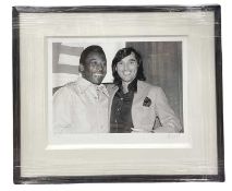 A limited edition numbered and signed giclée print - Pelé and George Best - with COA to rear. Signed
