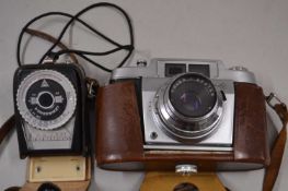 A vintage camera case and light meter