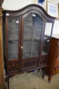 Edwardian china display cabinet with arched top over a single drawer, the body decorated