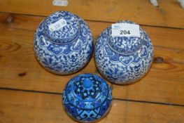 Two small ginger jars and further blue coloured example