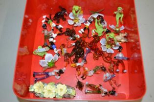 Small plastic box containing quantity of glass animals including frog musicians