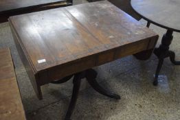 19th Century low Pembroke table raised over a central turned column set with two drawers with strung