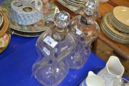 Pair of waisted glass decanters with silver necks and ball stoppers