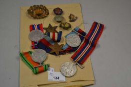 Quantity of British Service Medals, cap badges and postcards