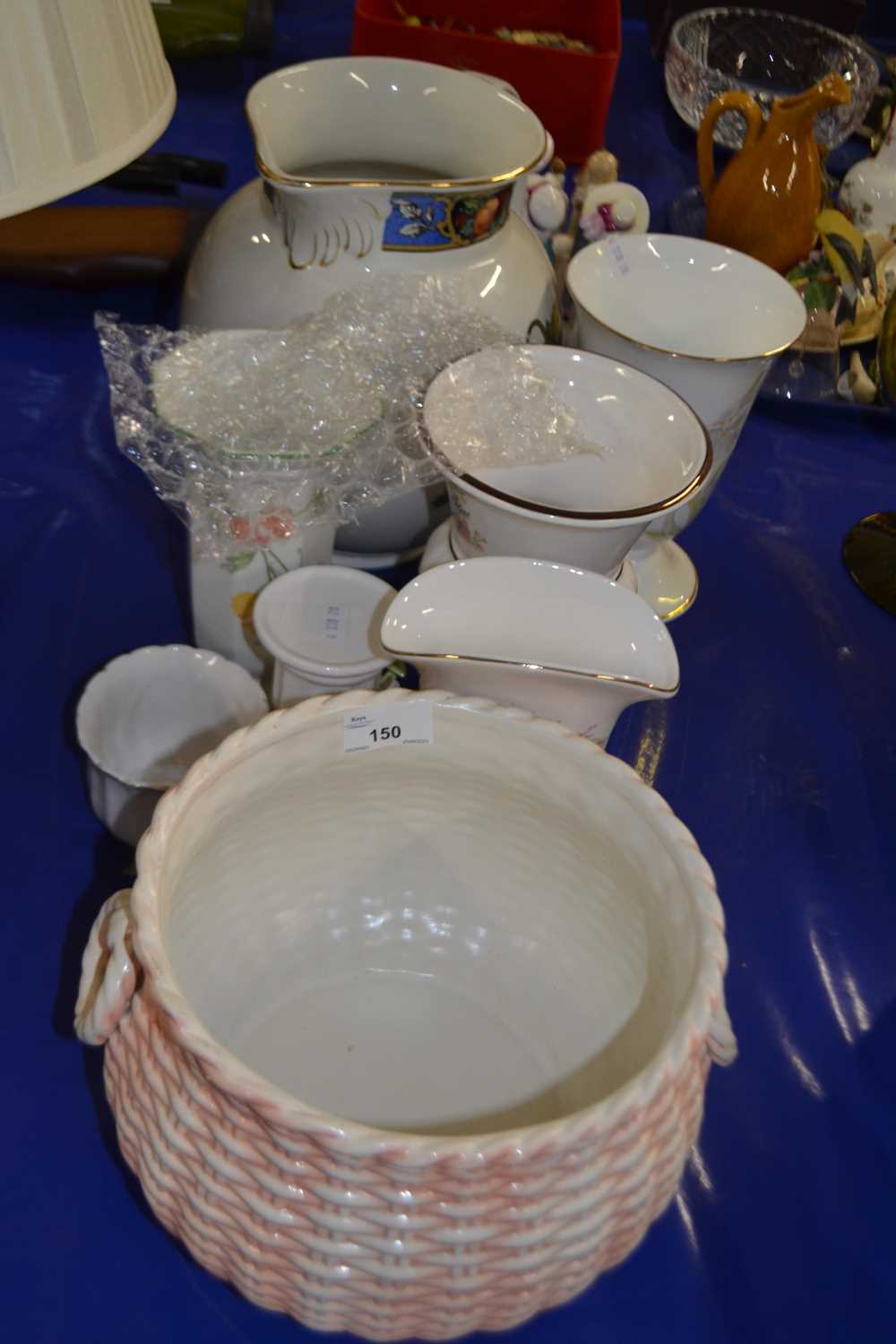 Group of ceramic wares including a basket weave jardiniere, other ceramic vases and a large jug
