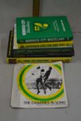 A signed Norwich City single together with a quantity of Norwich City books