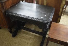 A heavily carved Colonial style side table, width approx 99cm