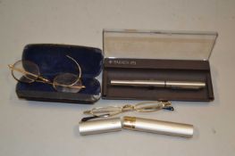 A Parker pen and two pairs of spectacles