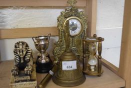 Brass mantel clock together with a pair of miniature trophy cups, bell, sand timer and other items