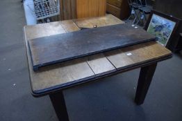 Extending dining table with extra leaf and winder