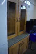 Glass fronted display cabinet with cupboards below