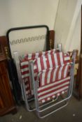 Two folding canvas deckchairs and another