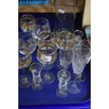 Selection of assorted drinking glasses and a glass vase