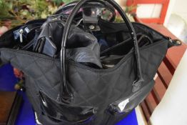 Lady's black tote and quantity of assorted handbags