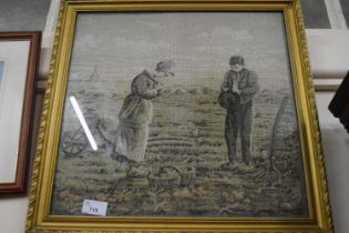 Needlework picture of a boy and a girl in a field in gilt frame