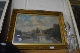 Print of a river with Church beyond in gilt frame