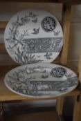 Two black and white patterned dinner plates