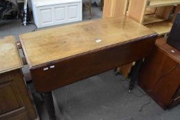 Drop leaf dining table with turned legs and casters