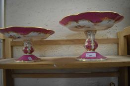 Two pink and gilt glazed and floral decorated comports