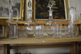 A pair of star decorated decanters together with another similar, four tumblers and a jug