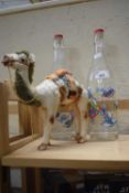 Two Smurf bottles together with a novelty camel