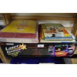 Laser tennis game, boxed together with jigsaws and children's annuals