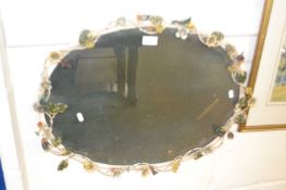 20th century oval wall mirror in a floral wire work mounted frame