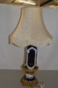 Blue and white porcelain based table lamp with metal mounts