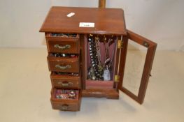 Table top jewellery cabinet filled with various costume jewellery