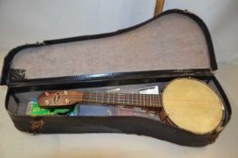 A ukulele, cased