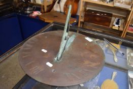 Patinated metal sun dial with Roman numerals, no maker's marks, 35cm diam
