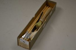 Box of mixed paint brushes