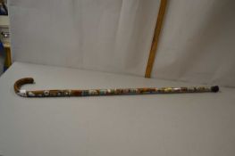 Walking stick mounted with various badges