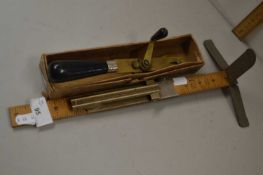 Mixed Lot comprising a dressmakers gauge and a further tool