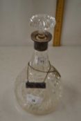 Silver mounted decanter with label