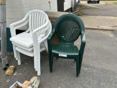 Set of four plastic Patio Chairs and two others.