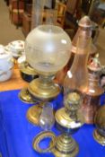 Three brass based oil lamps
