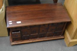 Modern hardwood bank of 18 small drawers