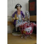 Pink mottled Murano glass basket together with a porcelain figure of a gentleman