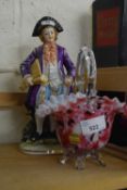 Pink mottled Murano glass basket together with a porcelain figure of a gentleman