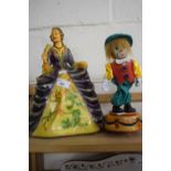 Pottery figure of a lady in ball gown together with a clockwork clown