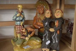 Figure of golfers, together with a resin figure of two monks and one of a Native American (3)