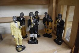 Six resin figures of a jazz band