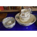 Washbowl and jug together with a matching soap dish and chamber pot decorated with flowers