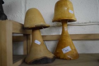 Two carved wooden mushrooms